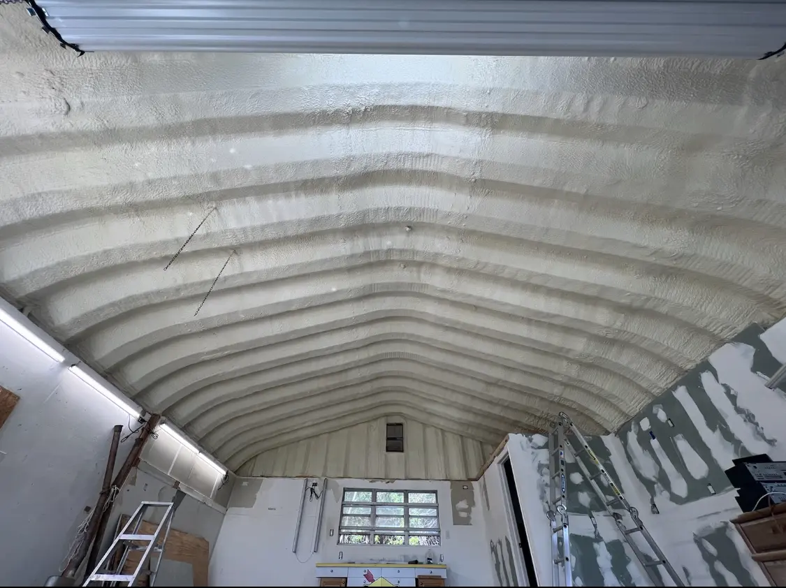 Spray polyurethane foam applied to the underside of a metal roof deck in Abington